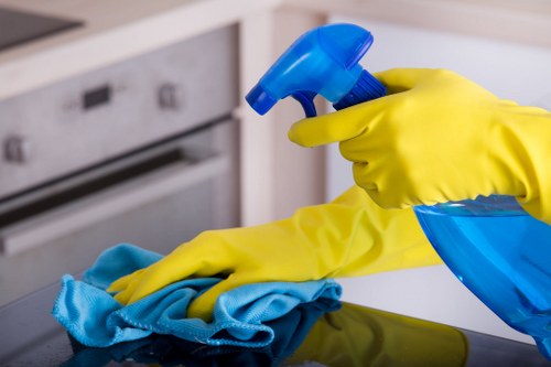 Technician treating mattress stains during mattress cleaning in Camden