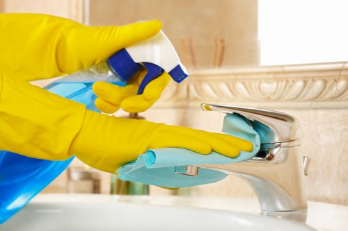 Technician preparing carpet cleaning equipment in a safe work area
