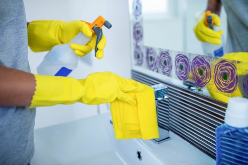 Technician using specialist upholstery cleaning equipment